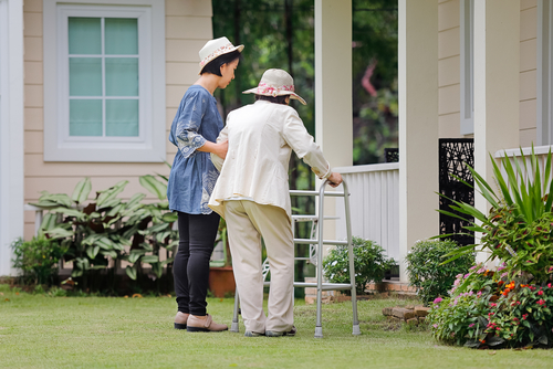 elderly woman exercising daughter