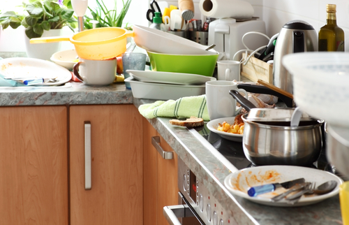 pile dirty dishes in kitchen