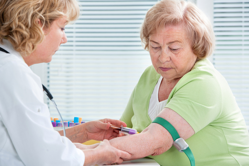 Nurse taking blood sample